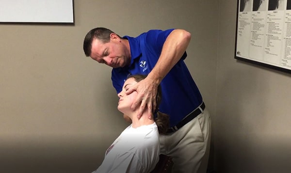 Dr. Klinginsmith Treating a Patient for Neck Pain and Headaches in Kearney, Nebraska